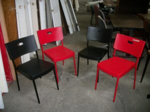 2 black chairs, 2 red chairs.