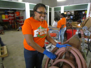Volunteer with hose.